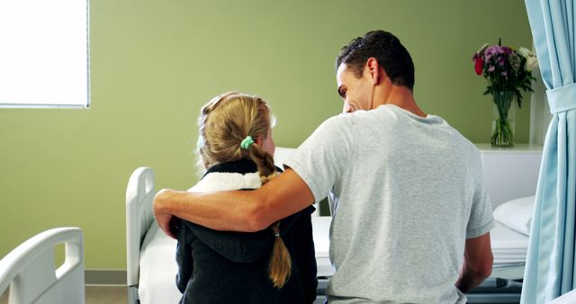 Father Comforting Daughter in Hospital Room - Download Free Stock Images Pikwizard.com