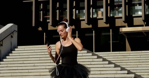 Ballet Dancer Embracing Modern Technology Outdoors