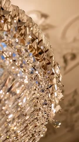 Tilting Camera Revealing Opulent Crystal Chandelier and Ballroom Medallion Vertical Video