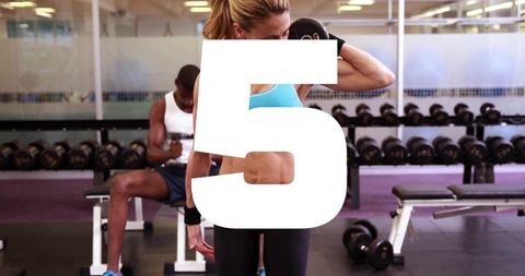 Fit woman lifting dumbbell performing right-arm curl in gym with bold numeral 5 overlay