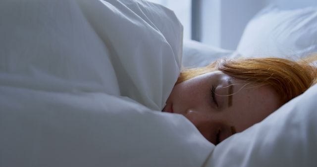 Young Caucasian woman sleeps peacefully in a cozy bed at home - Download Free Stock Photos Pikwizard.com