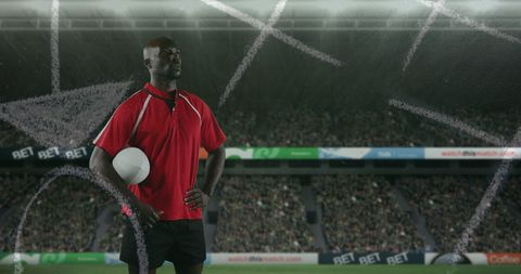 Rugby Player Analyzing Strategy at Stadium