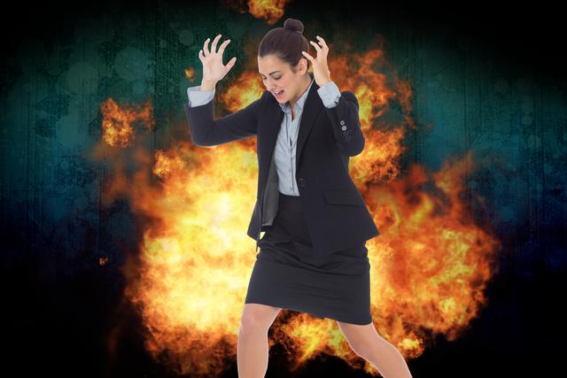 Digital composite of Digital composite image of angry businesswoman with fire