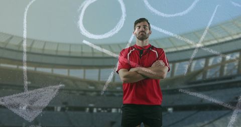 Confident Rugby Player with Strategy Diagram at Stadium