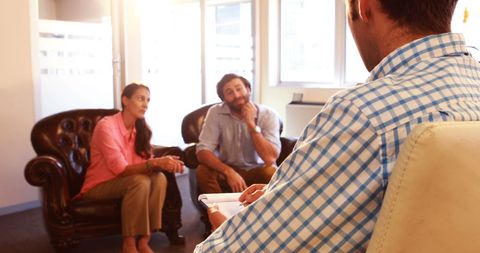 Couple in Counseling Session Engaged in Discussion with Therapist - Download Free Stock Images Pikwizard.com