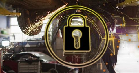 Female mechanic grinding under car with digital padlock overlay highlighting cybersecurity