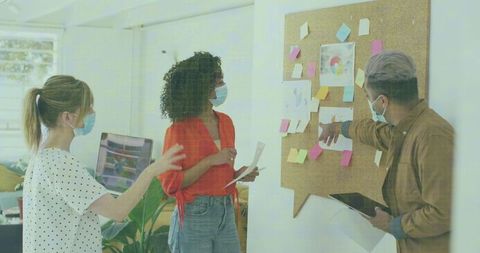 Colleagues Collaborating With Face Masks in Office