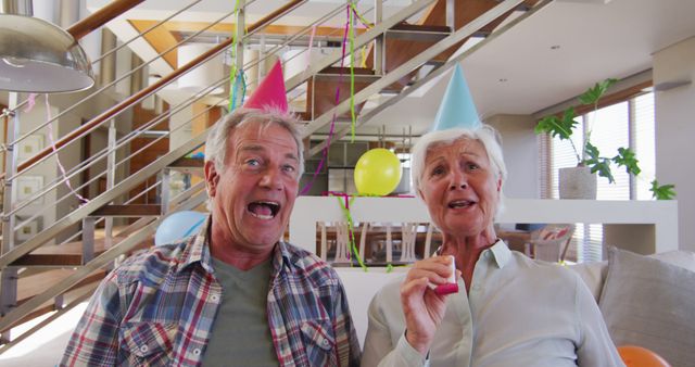 Joyful Senior Couple Celebrating at Home Party - Download Free Stock Images Pikwizard.com