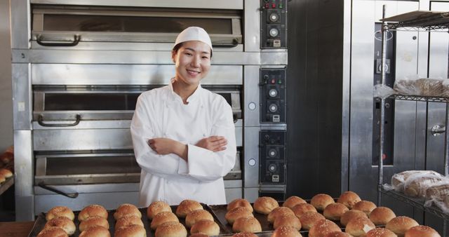 Smiling Baker with Freshly Baked Bread in Commercial Kitchen - Download Free Stock Images Pikwizard.com