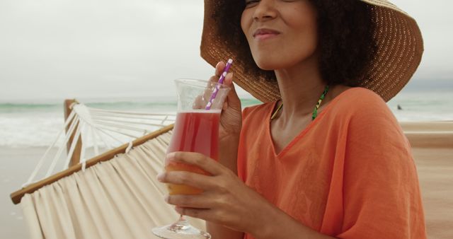 Relaxed Woman Enjoying Drink on Tropical Beach - Download Free Stock Images Pikwizard.com