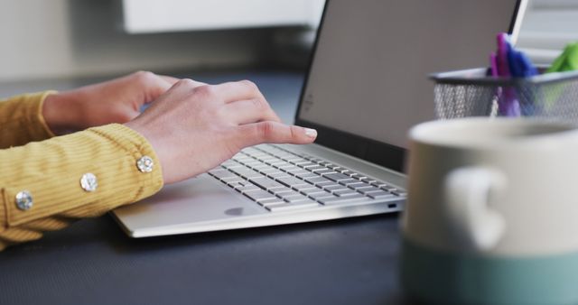 Close-up of Hands Typing on Laptop with Coffee Mug in Foreground - Download Free Stock Images Pikwizard.com