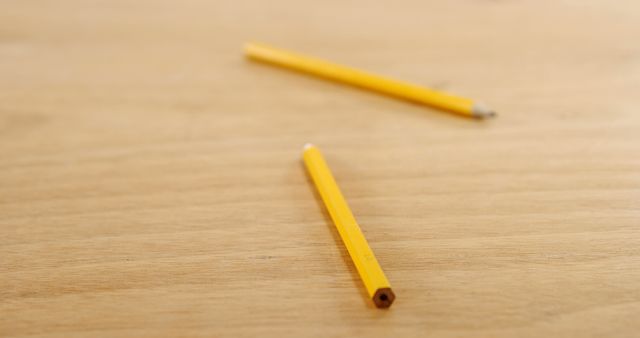 Two Yellow Pencils on Wooden Desk - Download Free Stock Images Pikwizard.com