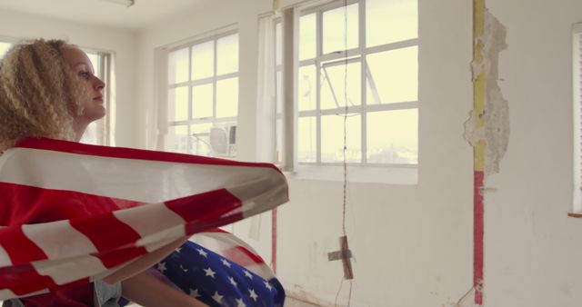 Woman Wrapped in American Flag in Barren Room - Download Free Stock Images Pikwizard.com