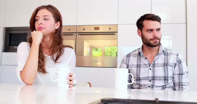 Couple Experiencing Tension in Contemporary Home Kitchen - Download Free Stock Images Pikwizard.com