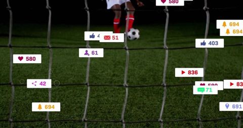 Kicking soccer ball through goal net at night with floating social media engagement icons