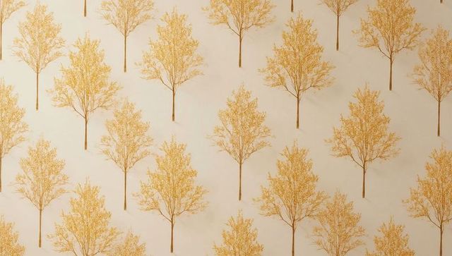 Repeating golden tree wallpaper featuring stylized birch motifs on beige paper texture