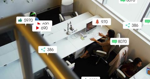 Office team working with social media notification overlays showing engagement kpi metrics