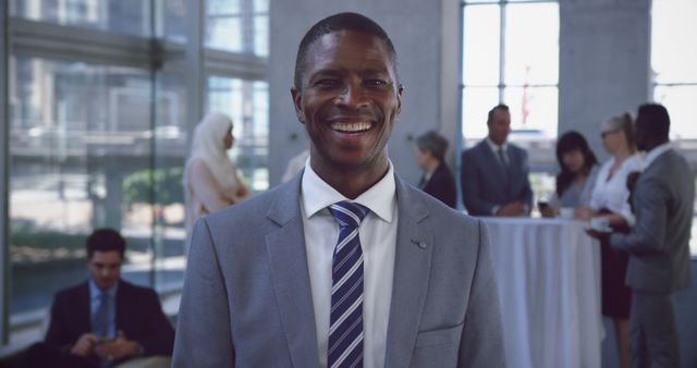 Smiling Businessman in Modern Office Gathering - Download Free Stock Images Pikwizard.com