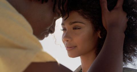 Couple Embracing on Sunny Beach Day