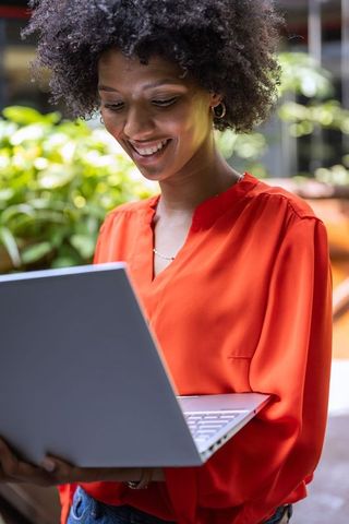 Confident Professional in Bright Blouse Connected Outdoors