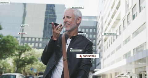 Senior man engaging with social media technology in urban cityscape