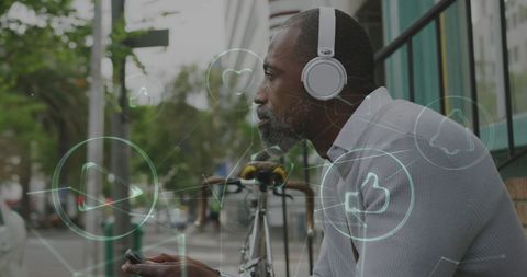 Mature man enjoying urban life with connectivity icons overlay