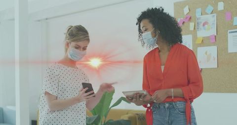 Businesswomen Collaborating with Technology During Pandemic