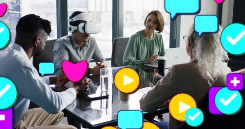 Team testing vr headset during collaborative office meeting with social media overlays