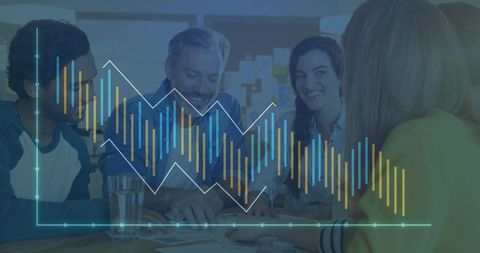 Business team collaborating at table with colorful data visualization overlay for strategy