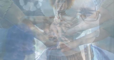 United hands of diverse people in solidarity and teamwork