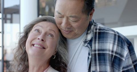 Romantic Diverse Couple Embracing on Sunlit Porch