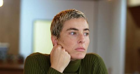 Pensive Woman with Short Hair in Green Sweater - Download Free Stock Images Pikwizard.com