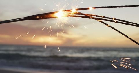 Sparkling Celebration by Ocean during Golden Sunset - Download Free Stock Images Pikwizard.com