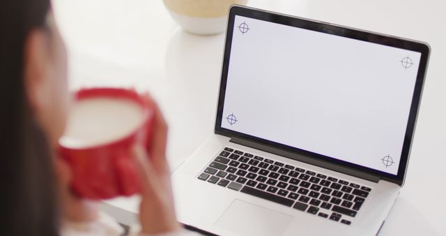 Woman Drinking Coffee and Using Blank Laptop Screen - Download Free Stock Images Pikwizard.com