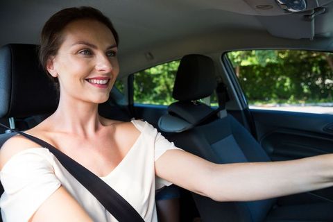 Confident Woman Ready for a Drive with Safety in Mind