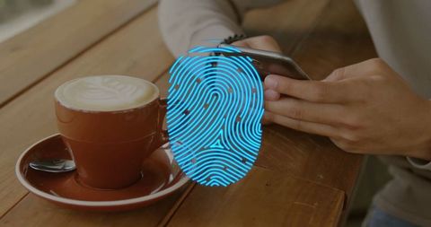 Man using smartphone at cafe with digital fingerprint overlay