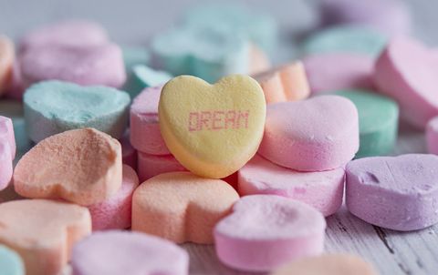 Colorful heart-shaped candy with inspirational message