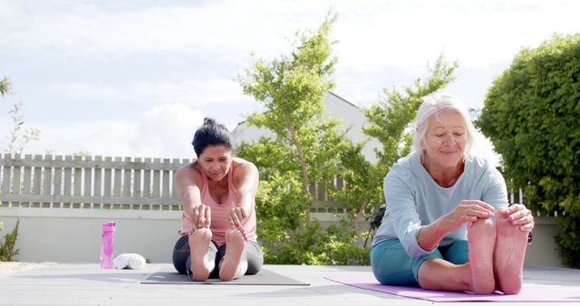Senior Woman and Younger Female Friend Doing Outdoor Yoga Together - Download Free Stock Images Pikwizard.com