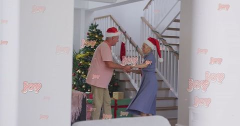 Senior Couple Joyously Dancing in Festive Holiday Setting