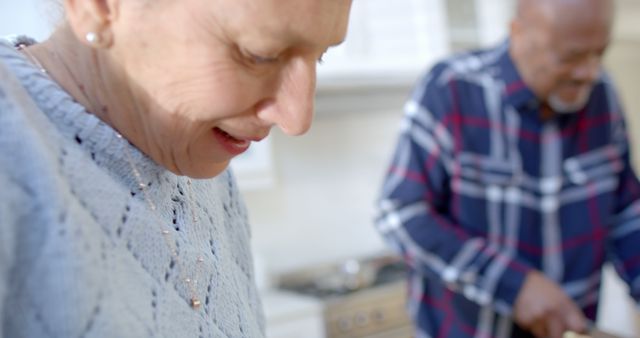 Smiling Elderly Couple Cooking Together in Kitchen - Download Free Stock Images Pikwizard.com