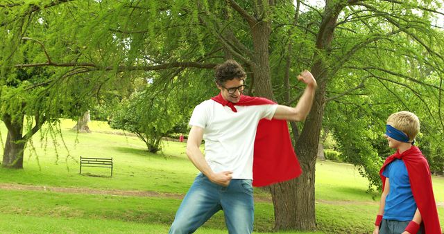 Father and Son Wearing Capes Playing Superheroes in Park - Download Free Stock Images Pikwizard.com