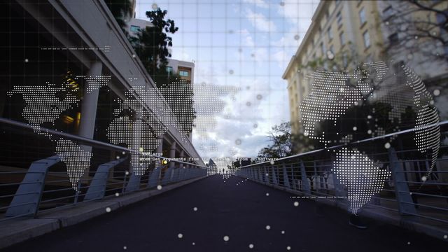 Visual shows world map overlay on city bridge during time-lapse, symbolizing global connectivity, business data exchange, and emerging technologies. Ideal for presentations, articles on global business networks, technological advancements, and modern urban planning projects.