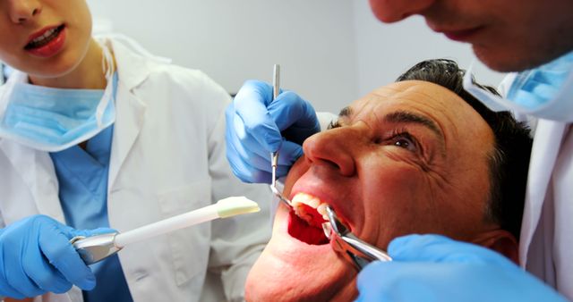 Dental Exam Procedure with Elderly Male Patient - Download Free Stock Images Pikwizard.com