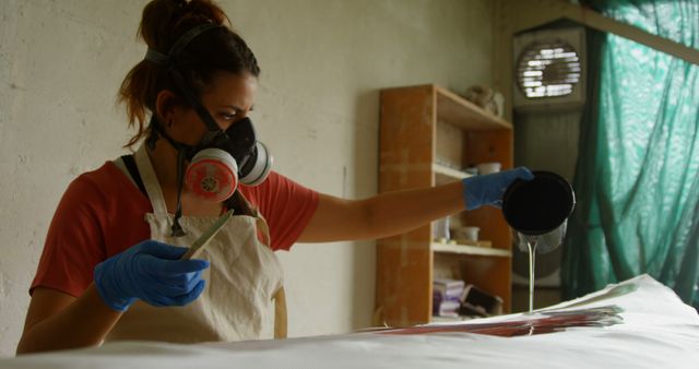 Woman in Workshop Pouring Resin Wearing Protective Gear - Download Free Stock Images Pikwizard.com