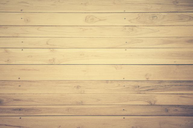 Light wooden planks background featuring natural wood grain texture. Ideal for use in web design, presentations, advertising, and as a backdrop for promotional content or products.