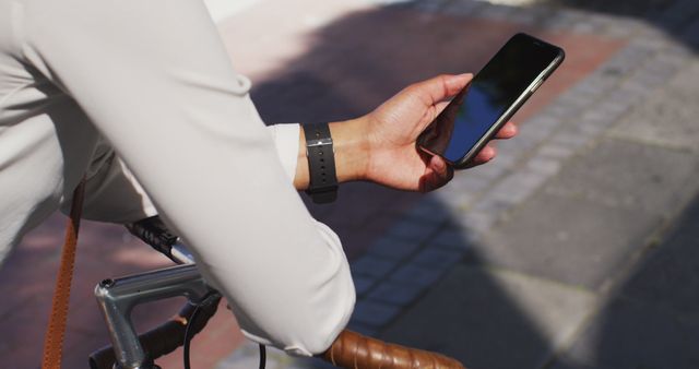 Person Checking Smartphone While Riding Bicycle - Download Free Stock Images Pikwizard.com