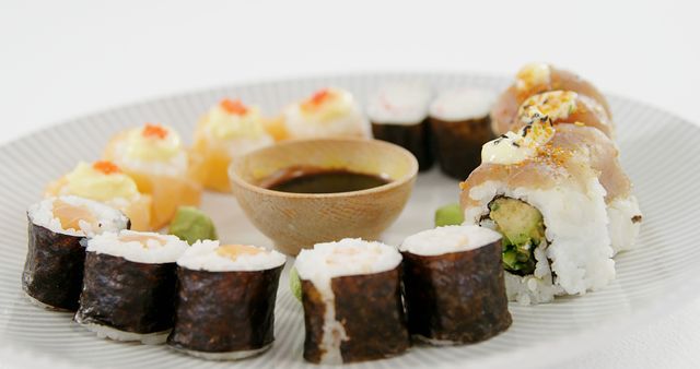 Close-up Assorted Sushi Plate with Dipping Sauce - Download Free Stock Images Pikwizard.com