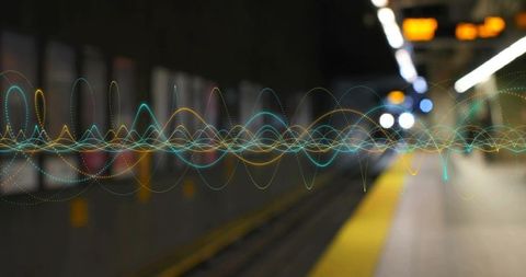 Streaming neon soundwaves across underground subway platform with bokeh lights