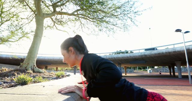 Woman Practicing Outdoor Fitness Push-Ups in Park - Download Free Stock Images Pikwizard.com