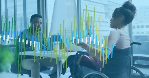 Inclusive Business Meeting Featuring Wheelchair User in Modern Office